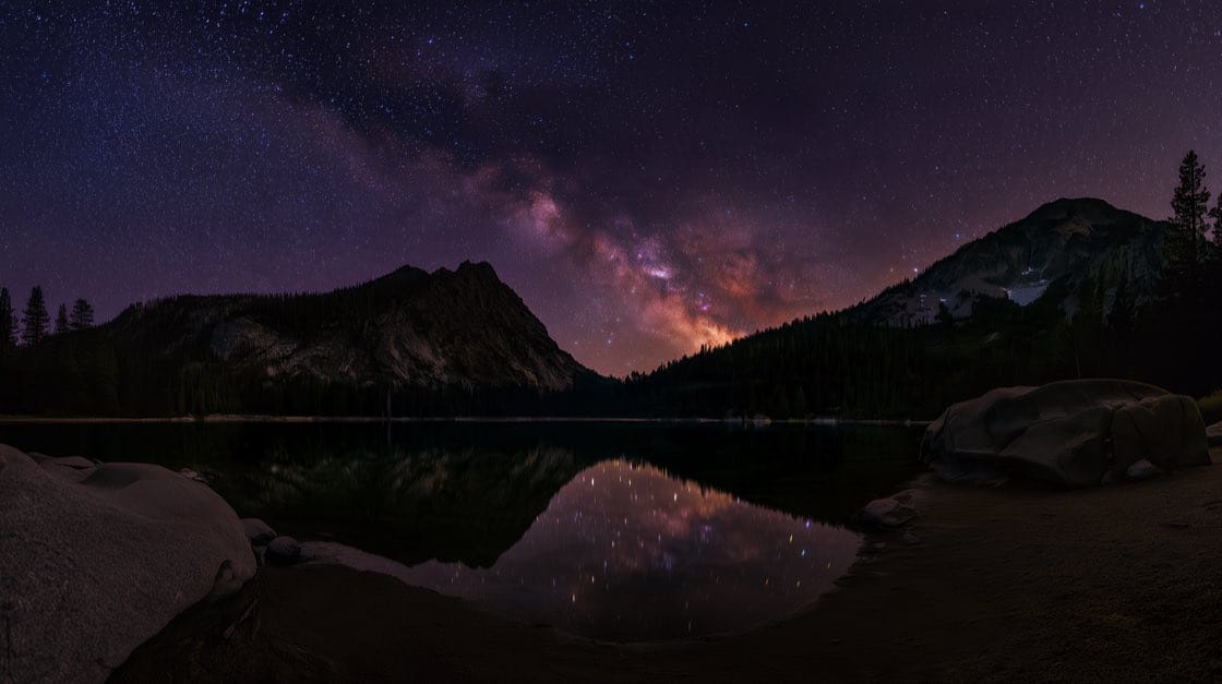The Milky Way reflected in a mountain lake